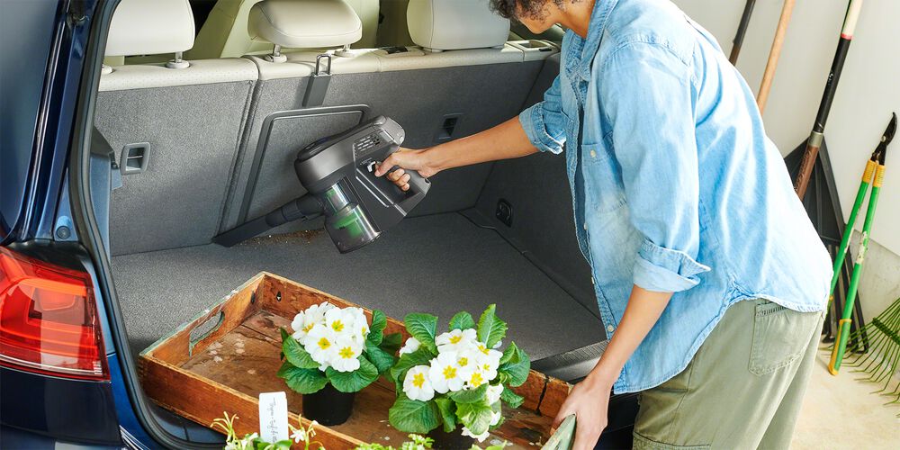 Vacuuming dirt out of a car