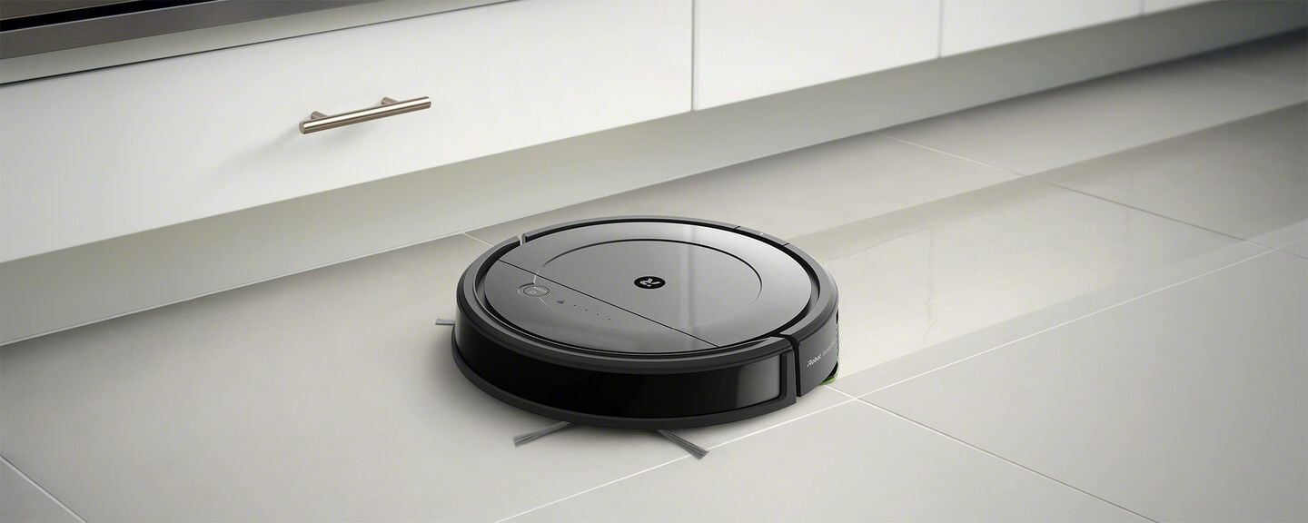 A Roomba mopping a floor
